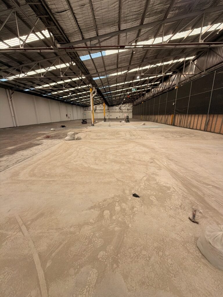 A bare warehouse slab before work starts